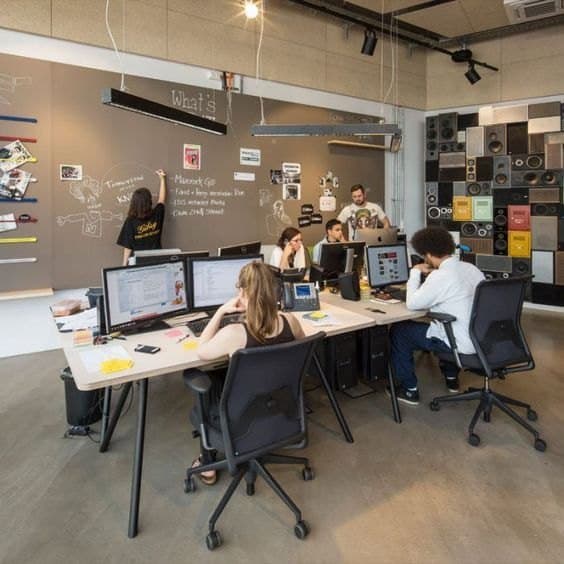 A team working at desks in an open-plan office