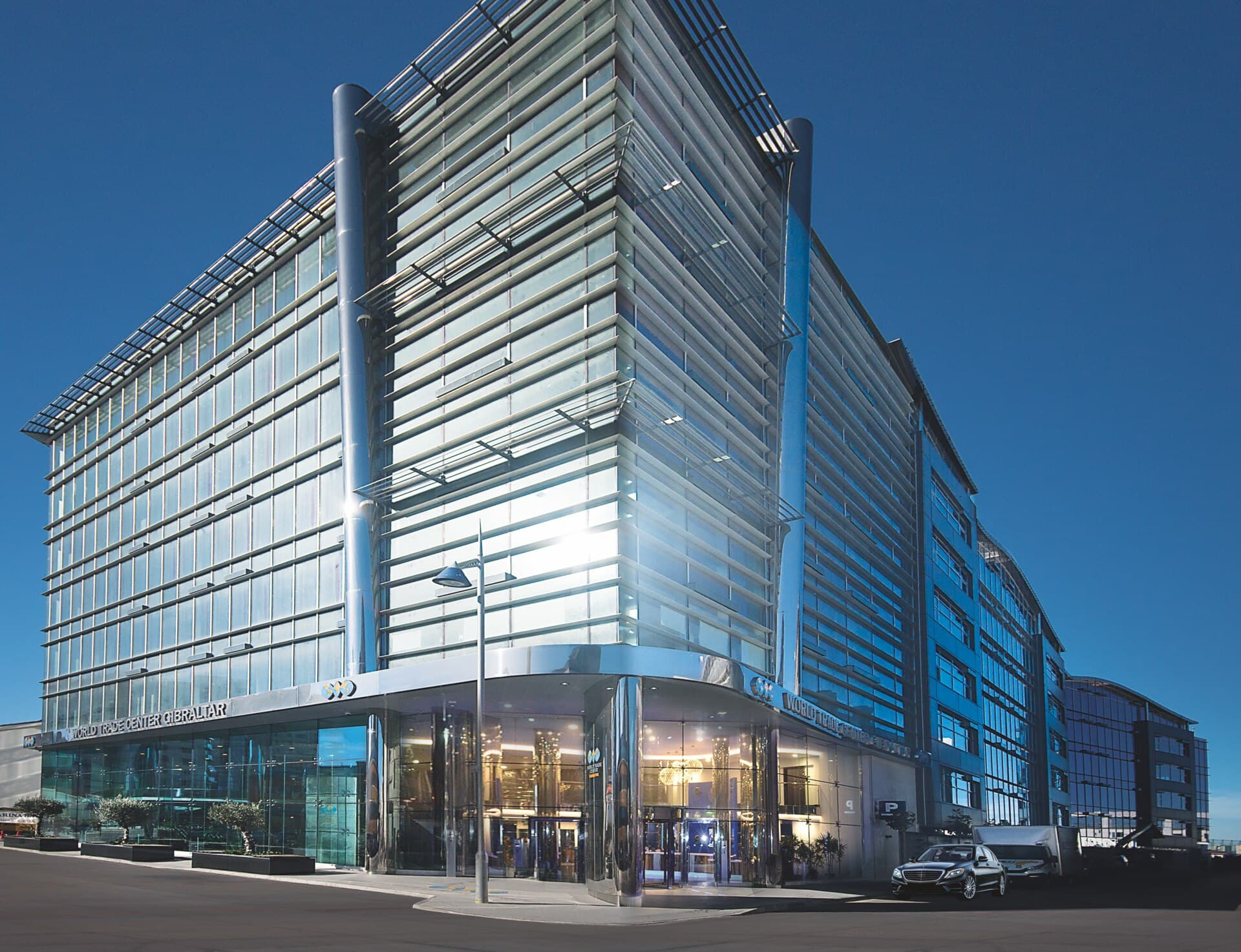 The glass front of the World Trade Center Gibraltar, seen from the corner